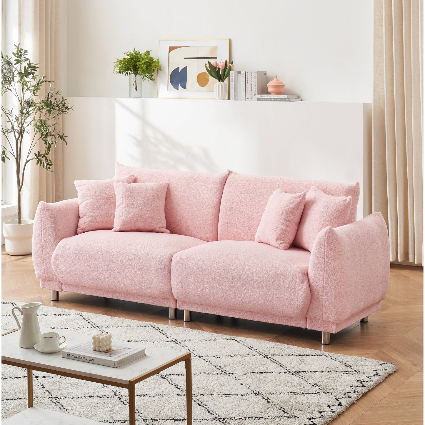 86.6 inch teddy fleece pink sofa with four throw pillows and hardware feet can sit comfortably in an apartment bedroom