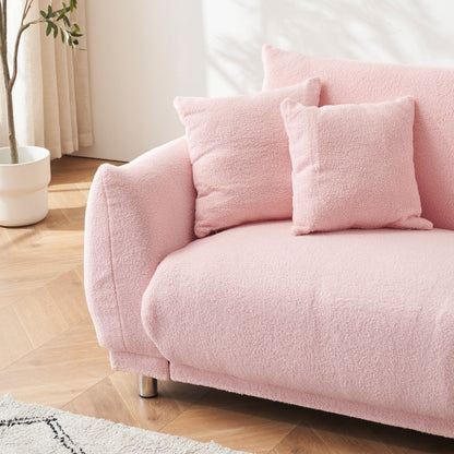 86.6 inch teddy fleece pink sofa with four throw pillows and hardware feet can sit comfortably in an apartment bedroom