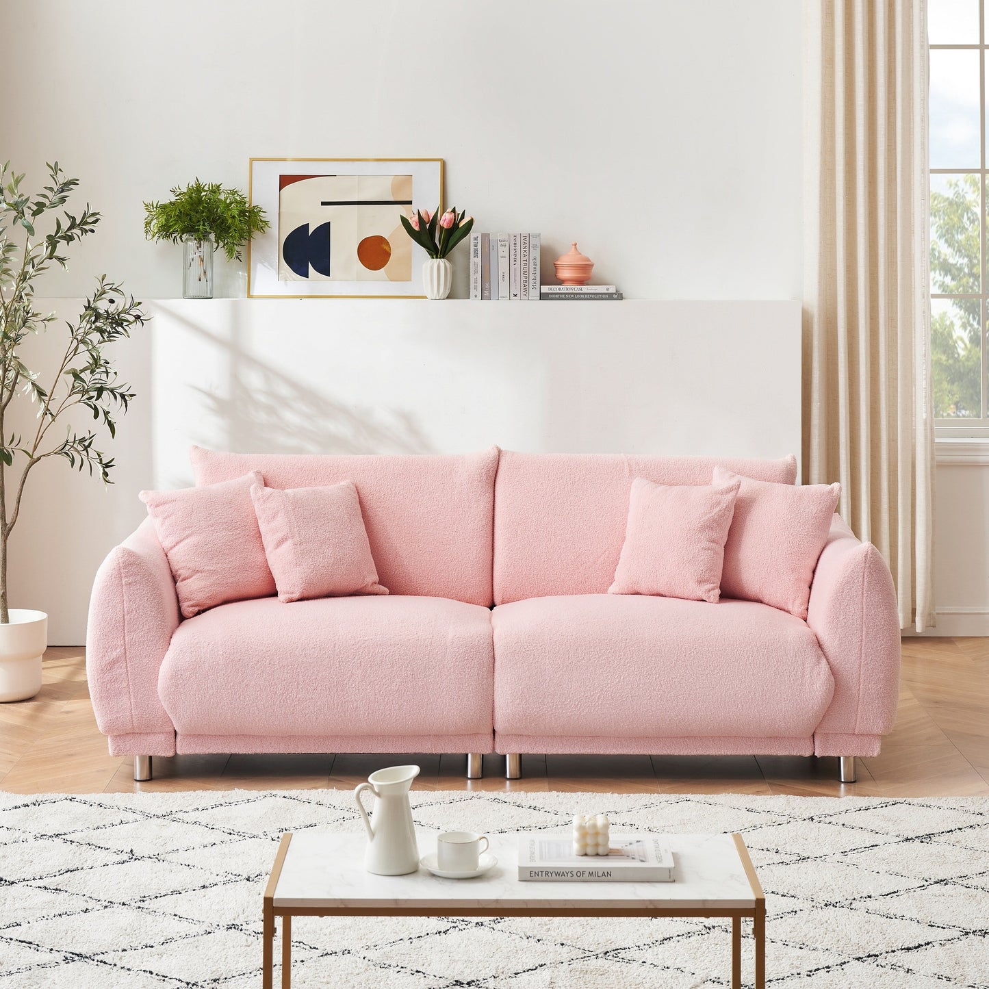 86.6 inch teddy fleece pink sofa with four throw pillows and hardware feet can sit comfortably in an apartment bedroom