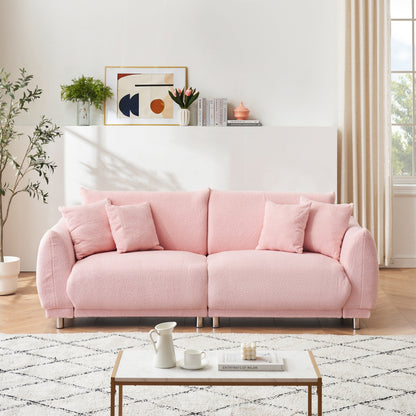 86.6 inch teddy fleece pink sofa with four throw pillows and hardware feet can sit comfortably in an apartment bedroom